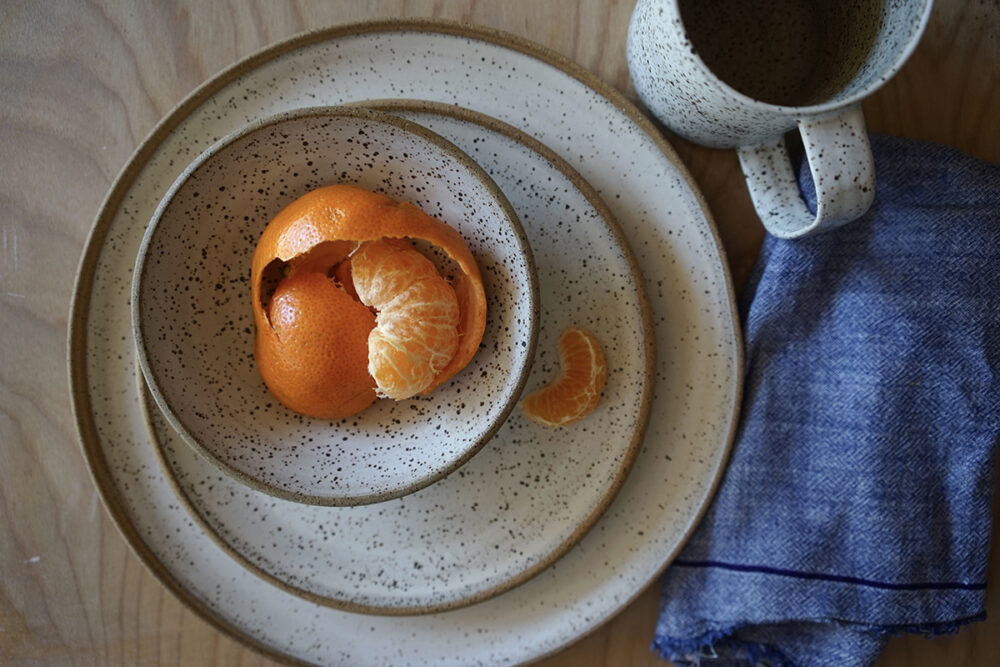bowl plates and mug with orange