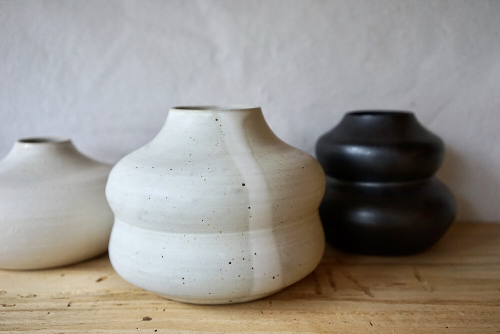 white and black ceramic vases